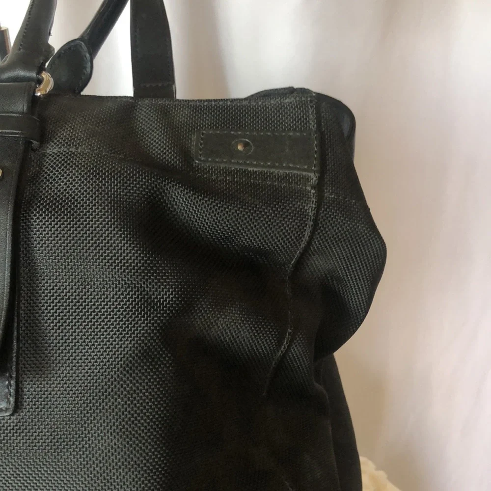 TUMI large black weekender bag. Leather and nylon. Detachable strap.